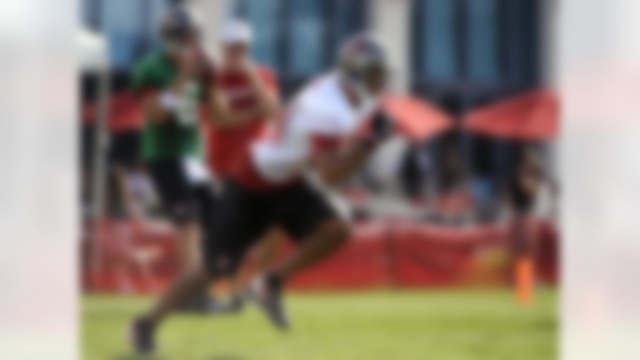 Tampa Bay Buccaneers wide receiver Vincent Jackson, right, takes off as quarterback Dan Orlovsky drops back for a pass during NFL football training camp, Friday, July 27, 2012, in Tampa, Fla. (AP Photo/Brian Blanco)