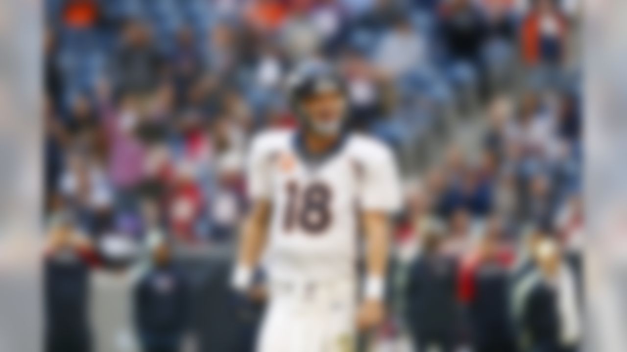 Denver Broncos quarterback Peyton Manning (18) smiles after throwing his 51st touchdown pass of the season during an NFL football game against the Houston Texans at Reliant Stadium on Sunday December 22, 2013 in Houston, Texas. (Aaron M. Sprecher/NFL)