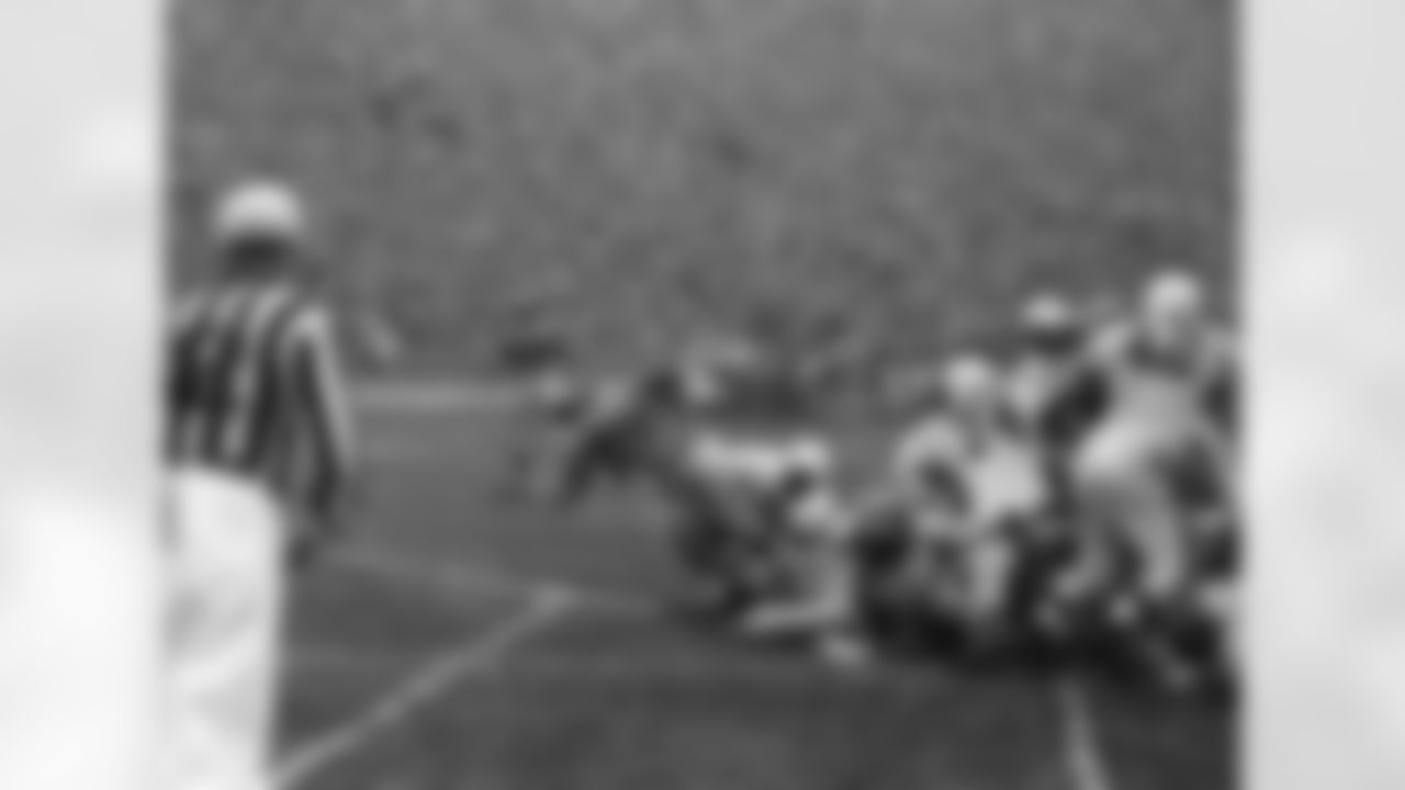 Deacon Dan Towler falls into the end zone to score the Los Angeles Rams second touchdown from the one-foot line as Cleveland Browns Fullback Marion Motley (76) is unable to hold him back in the championship playoff game in Los Angeles, on Dec. 23, 1951. (Associated Press)