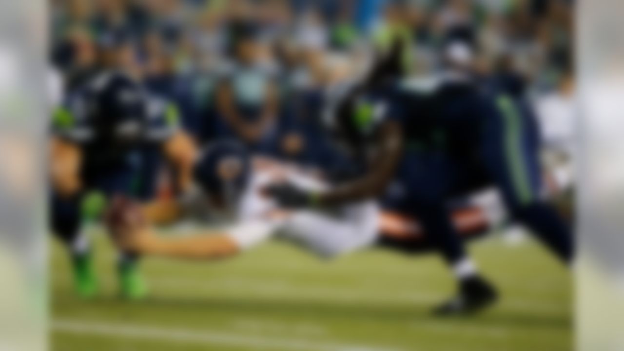 /Chicago Bears quarterback Jimmy Clausen (8) dives forward but is short of the end zone during the preseason NFL game between the Chicago Bears and the Seattle Seahawks on Friday, Aug. 22, 2014 at CenturyLink Field in Seattle. (Ric Tapia/NFL)