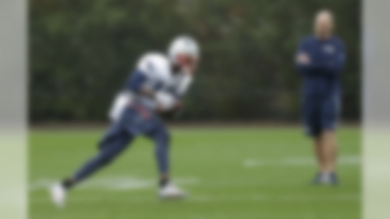 New England Patriots wide receiver Brandon LaFell catches a pass as receivers coach Chad O'Shea, right, watches during practice Friday, Jan. 30, 2015, in Tempe, Ariz. The Patriots play the Seattle Seahawks in NFL football Super Bowl XLIX Sunday, Feb. 1. (AP Photo/Mark Humphrey)