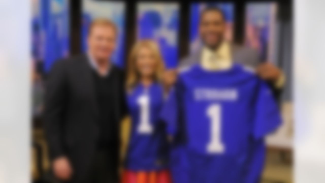 In this photo provided by Disney-ABC Domestic Television, NFL commissioner Roger Goodell, left, poses with Kelly Ripa and Michael Strahan after presenting them with NFL Draft first round jerseys on "LIVE with Kelly and Michael" Tuesday, April 23, 2013 in New York. (AP Photo/Disney-ABC, Jeff Neira)