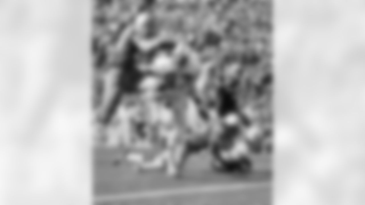 Dallas Cowboys Hall of Fame cornerback Mel Renfro (20) brings down Baltimore Colts wide receiver Ed Hinton (33) as receiver Roy Jefferson (87) moves to block leaping Hall-of-Fame cornerback Herb Adderley (26) during Super Bowl V, a 16-13 Colts victory on January 17, 1971, at the Orange Bowl in Miami, Florida. (Vernon Biever/NFL)