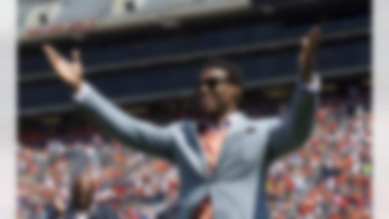 Auburn Heisman Trophy winner Cam Newton acknowledges the crowd after being introduced prior to the annual spring A-Day game at Jordan-Hare Stadium in Auburn, Ala., Saturday, April 14, 2012. Newton feels like his improvement going into Year 2 as an NFL quarterback "is through the roof." (AP Photo/Dave Martin)