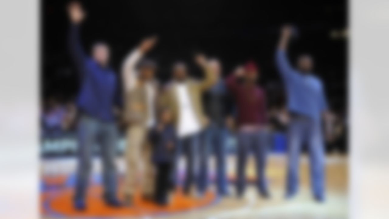 Members of the Super Bowl-champion New York Giants wave as they are introduced during a timeout in the NBA basketball game between the Utah Jazz and the New York Knicks on Monday, Feb. 6, 2012, in New York. From left are Bear Pascoe, Corey Webster, Hakeem Nicks, Mark Herzlich, Aaron Ross and Mathias Kiwanuka. (AP Photo/Kathy Kmonicek)