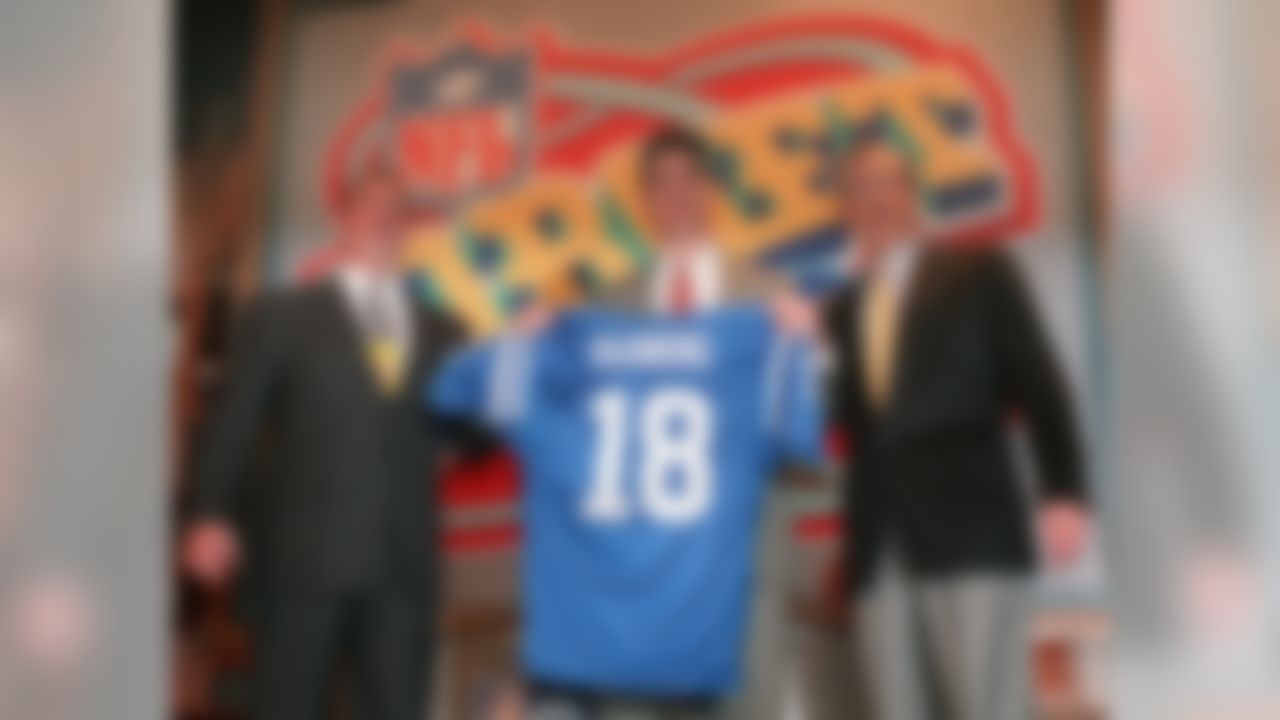 Quarterback Peyton Manning, of Tennessee, holds up an Indianapolis Colts jersey as he is flanked by Colts owner Jim Irsay, left, and NFL Commissioner Paul Tagliabue Saturday, April 18, 1998, in New York after being chosen by the Colts as the No. 1 pick in the in draft Saturday. (AP Photo/Adam Nadel)