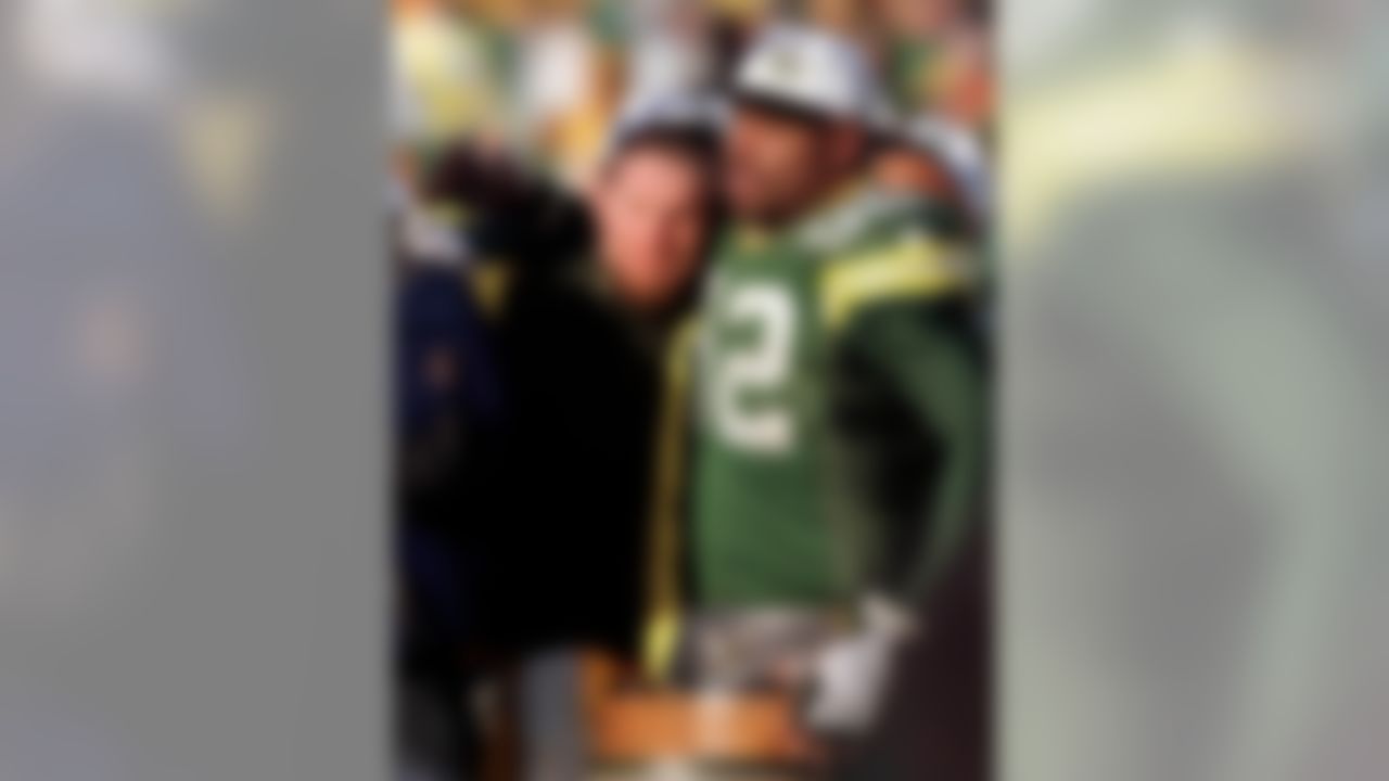 Green Bay Packers defensive end Reggie White (92) hugs quarterback Brett Favre during the NFC Championship trophy presentation in Green Bay, Wis., in this Jan. 12, 1997 file photo The Packers beat the Carolina Panthers 30-13 to advance to Super Bowl XXXI in New Orleans. (AP Photo/Morry Gash)
