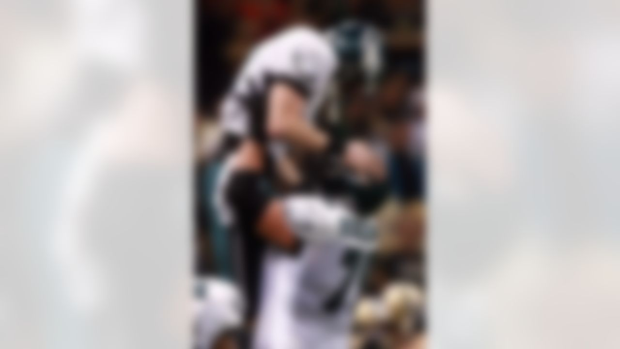 NEW ORLEANS - JANUARY 13: Todd Herremans #79 of the Philadelphia Eagles celebrates with quaterback Jeff Garcia #7 after a touchdown in the first quarter against the New Orleans Saints during the NFC divisional playoff game at the Superdome on January 13, 2007 in New Orleans, Louisiana. Photo by Getty Images.