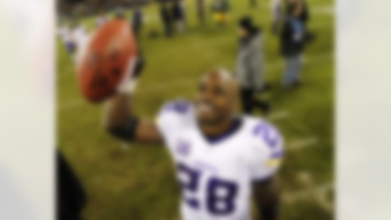 Minnesota Vikings' Adrian Peterson celebrates after an NFL football game against the Green Bay Packers Sunday, Jan. 3, 2016, in Green Bay, Wis. The Vikings won 20-13. (AP Photo/Matt Ludtke)