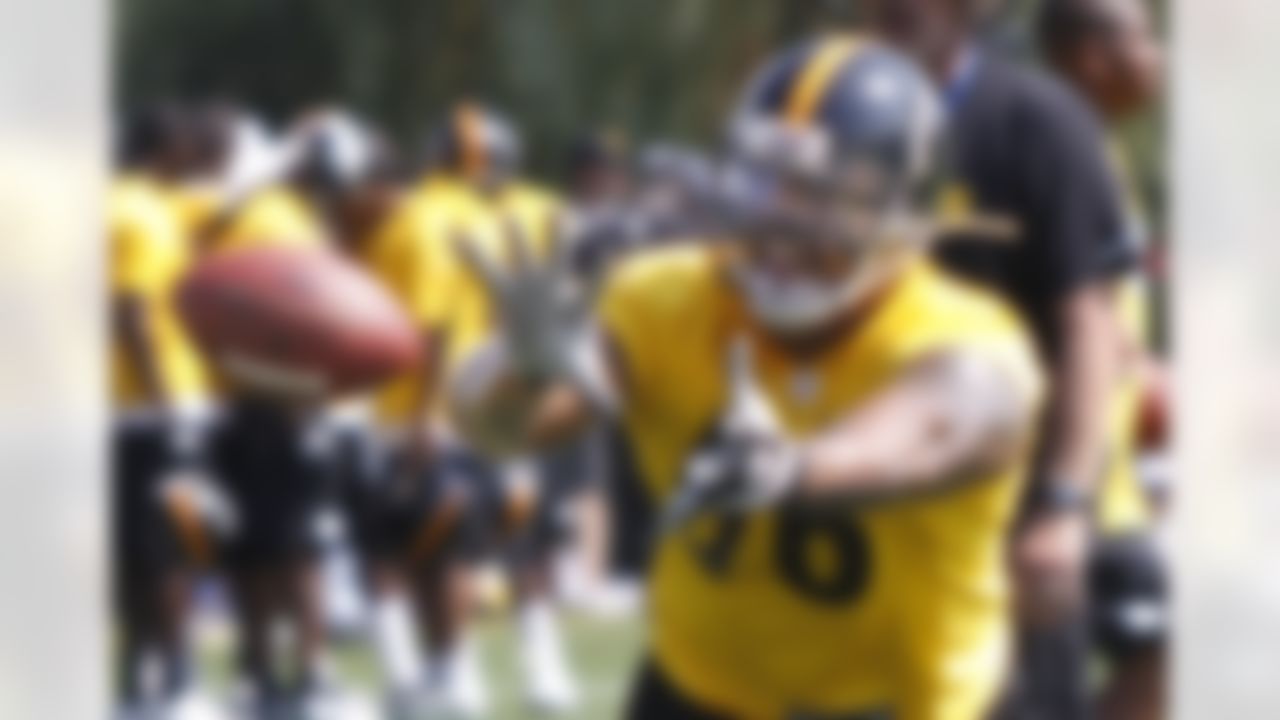 Pittsburgh Steelers linebacker LaMarr Woodley (56) catches a football in a drill during practice at the NFL football training camp in Latrobe, Pa. on Friday, July 27, 2012 . (AP Photo/Keith Srakocic)