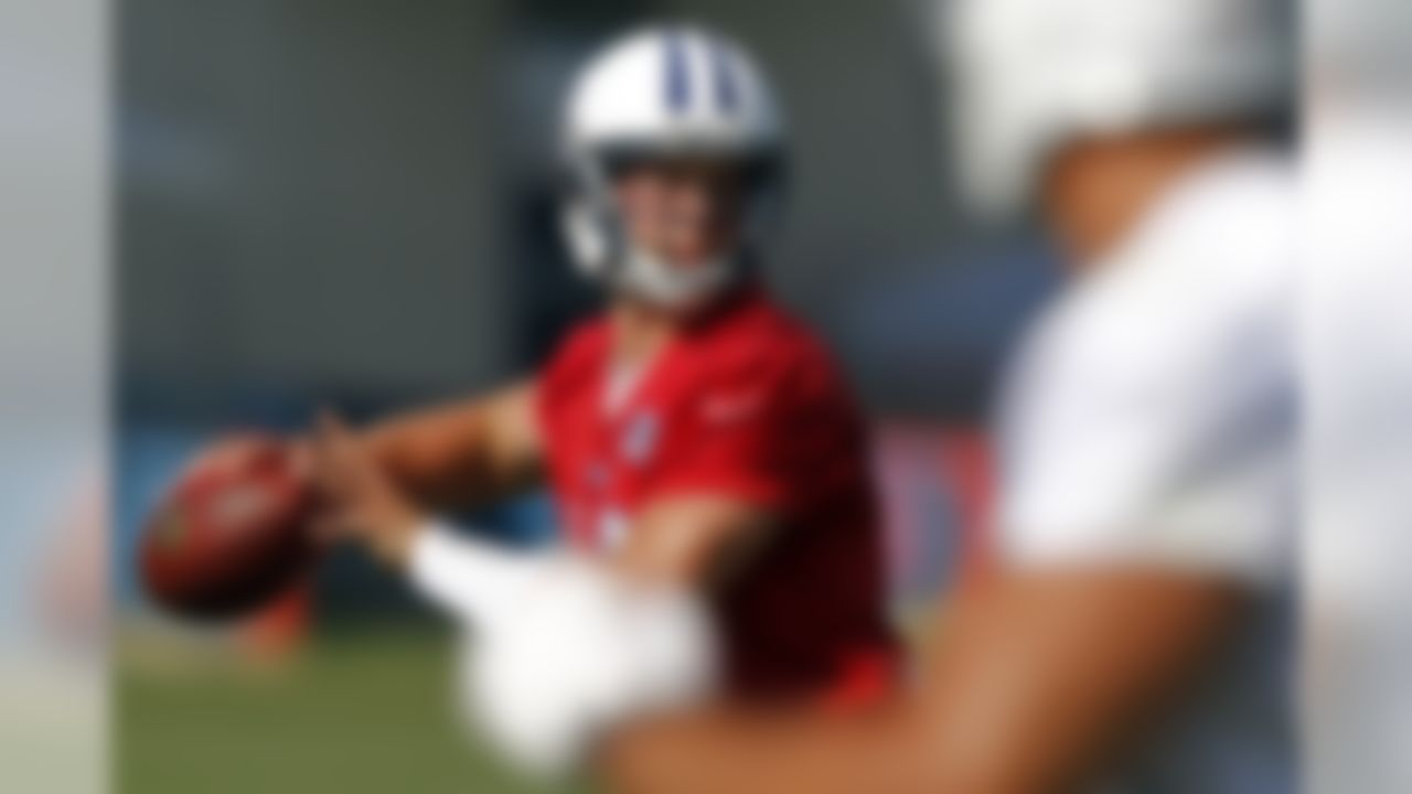 Tennessee Titans quarterback Jake Locker throws to a receiver during NFL football camp at Titans' headquarters Saturday, July 28, 2012 Nashville, Tenn. (AP Photo/Wade Payne)