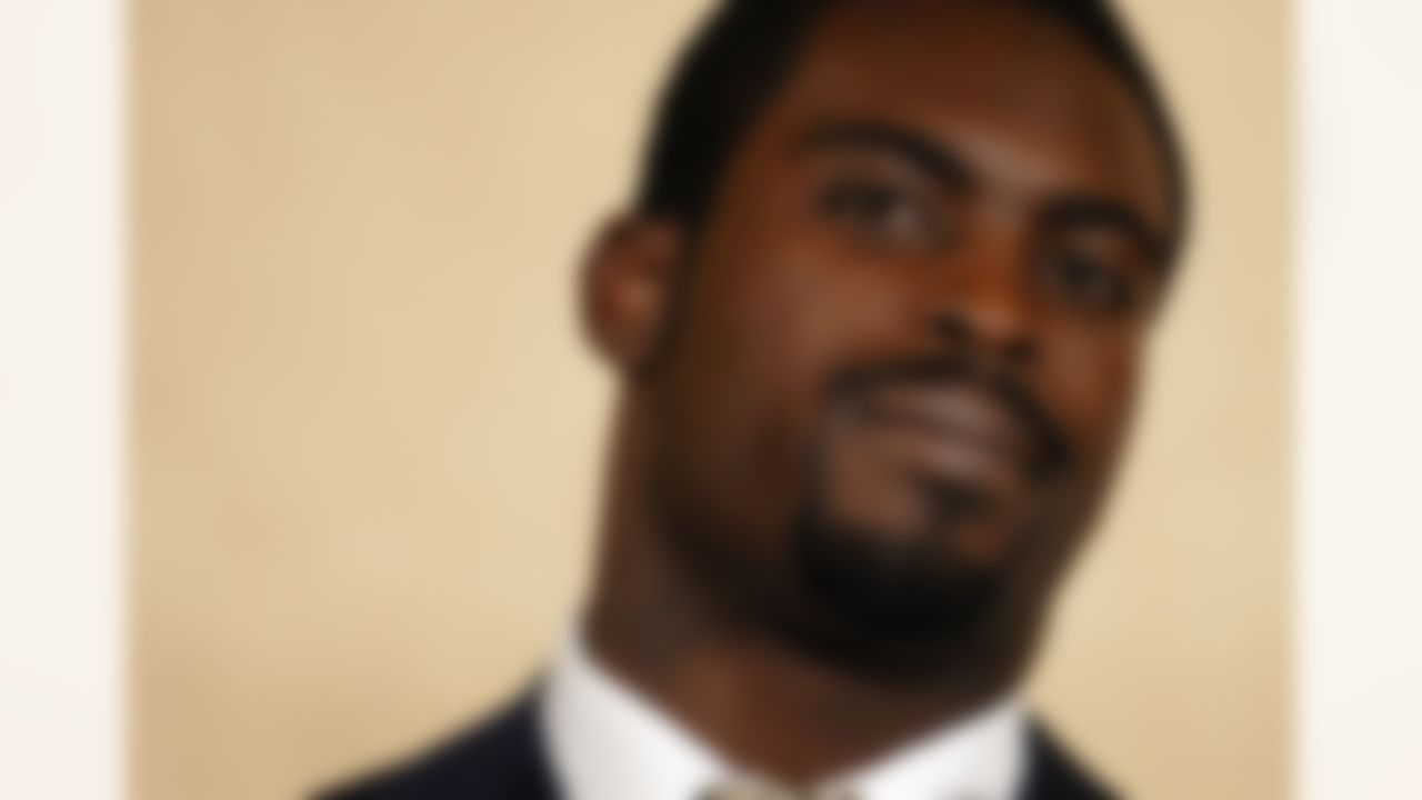 RICHMOND, VA - AUGUST 27: Atlanta Falcons quarterback Michael Vick speaks to reporters at the Omni Richmond Hotel after agreeing to a guilty plea on charges stemming from his involvement in a dogfighting ring August 27, 2007, in Richmond, Virginia. (Photo by Jonathan Ernst/Getty Images)