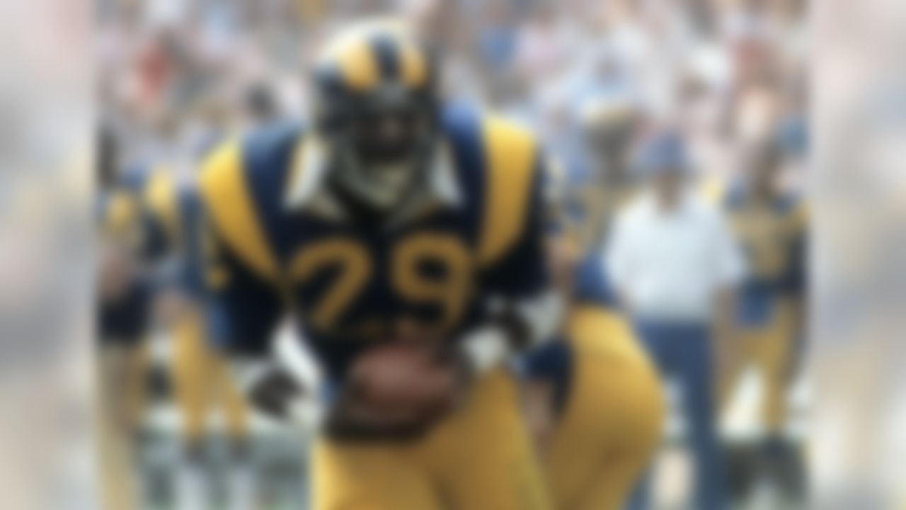 Hall of Fame running back Eric Dickerson (29) of the Los Angeles Rams carries the football during the Rams 27-21 victory over the Atlanta Falcons on October 16, 1983 at Anaheim Stadium in Anaheim, California. (National Football League)