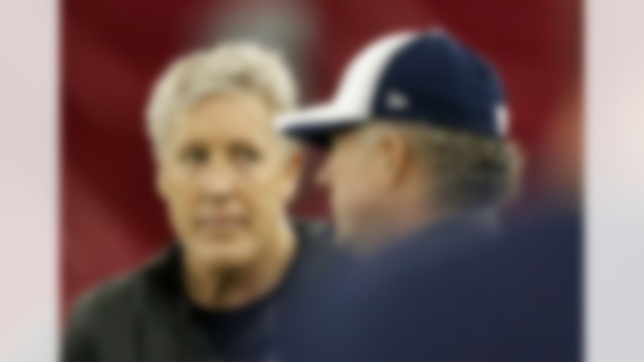Seattle Seahawks head coach Pete Carroll, left, talks with quarterbacks coach Carl Smith during a team practice for NFL Super Bowl XLIX football game, Friday, Jan. 30, 2015, in Tempe, Ariz. The Seahawks play the New England Patriots in Super Bowl XLIX on Sunday, Feb. 1, 2015. (AP Photo/Matt York)