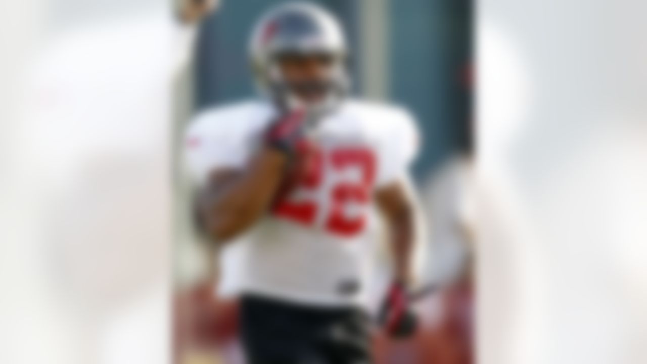 Tampa Bay Buccaneers' running back Doug Martin participates in a drill during a workout at NFL football training camp, Saturday, July 28, 2012, in Tampa, Fla. (AP Photo/Mike Carlson)