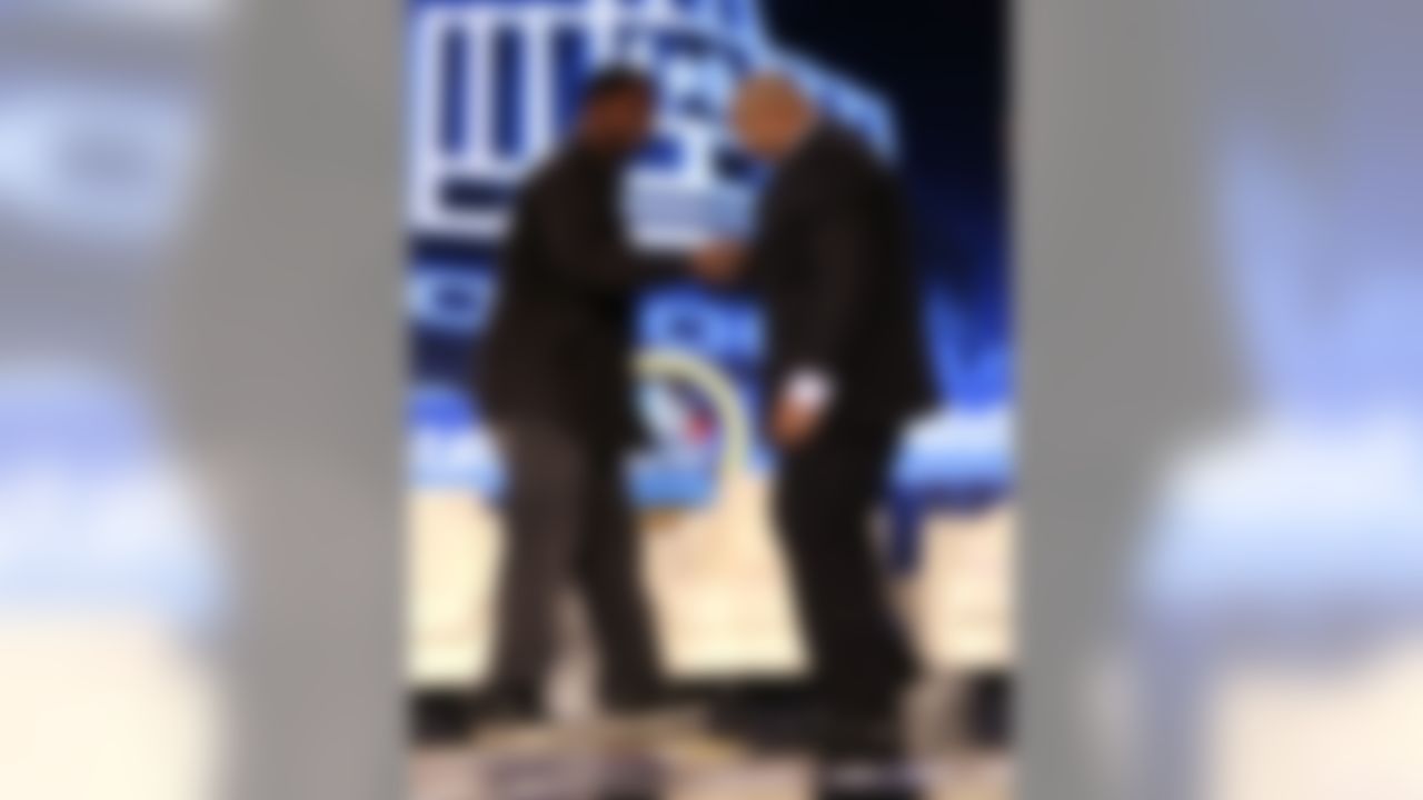 Former Baltimore offensive lineman Jonathan Ogden, left, greets former Dallas Cowboy offensive lineman Larry Allen after they were elected to Pro Football Hall of Fame on Saturday, Feb. 2, 2013, New Orlean.s (AP Photo/Gerald Herbert)