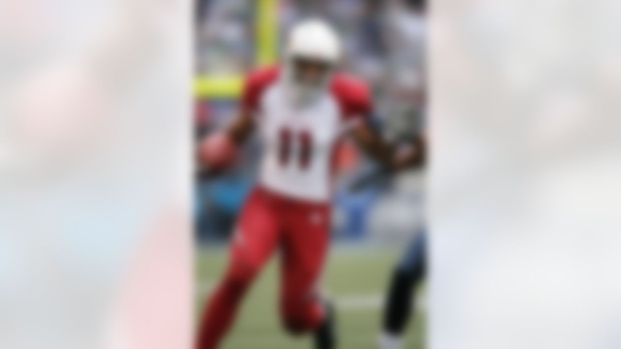 SEATTLE - DECEMBER 9: Wide receiver Larry Fitzgerald #11 of the Arizona Cardinals rushes against the Seattle Seahawks December 9, 2007 at Qwest Field in Seattle, Washington. The Seahawks defeated the Cardinals 42-21. (Photo by Otto Greule Jr/Getty Images)