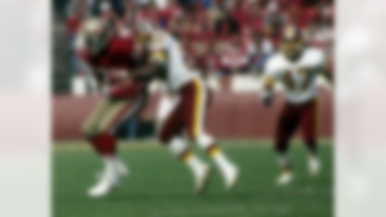 Washington Redskins cornerback Darrell Green (28) hits San Francisco 49ers wide receiver Jerry Rice (80) as Rice makes the catch during the NFC Divisional Playoff, a 28-10 49ers victory on January 12, 1991, at Candlestick Park in San Francisco, California. (Photo by Arthur Anderson/NFL)