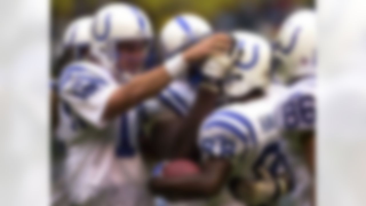 Indianapolis Colts quarterback Peyton Manning, left, congratulates teammate Marvin Harrison, right, after they connected for a 77-yard reception in their preseason game against the Pittsburgh Steelers Saturday, Aug. 19, 2000, in Mexico City. (AP Photo/Gregory Bull)