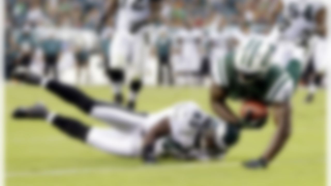 New York Jets running back Terrance Ganaway, right, scores a touchdown over Philadelphia Eagles safety Phillip Thomas in the first half of a preseason NFL football game, Thursday, Aug. 30, 2012, in Philadelphia. (AP Photo/Matt Rourke)