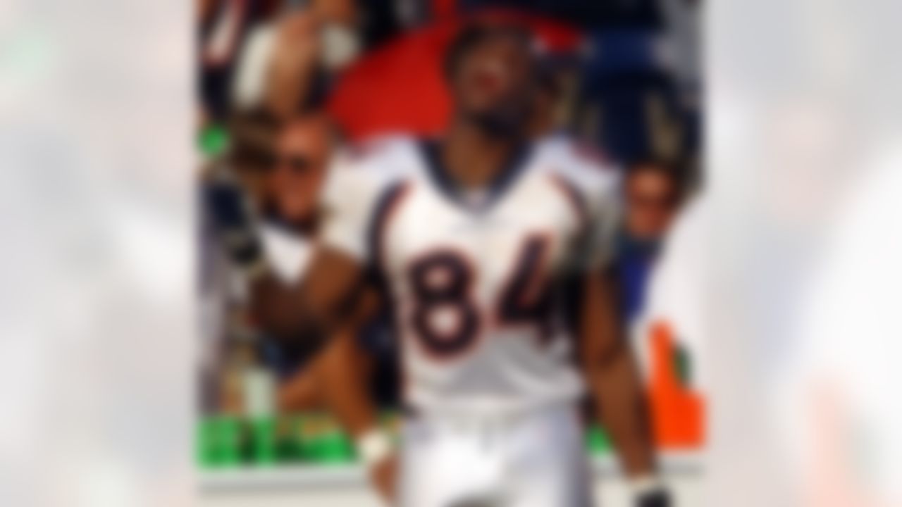 Denver Broncos' Shannon Sharpe sings a song as he celebrates in the closing minutes of the Broncos' 37-13 victory over the San Diego Chargers, Sunday Sept. 14, 2003, in San Diego. (AP Photo/Denis Poroy)