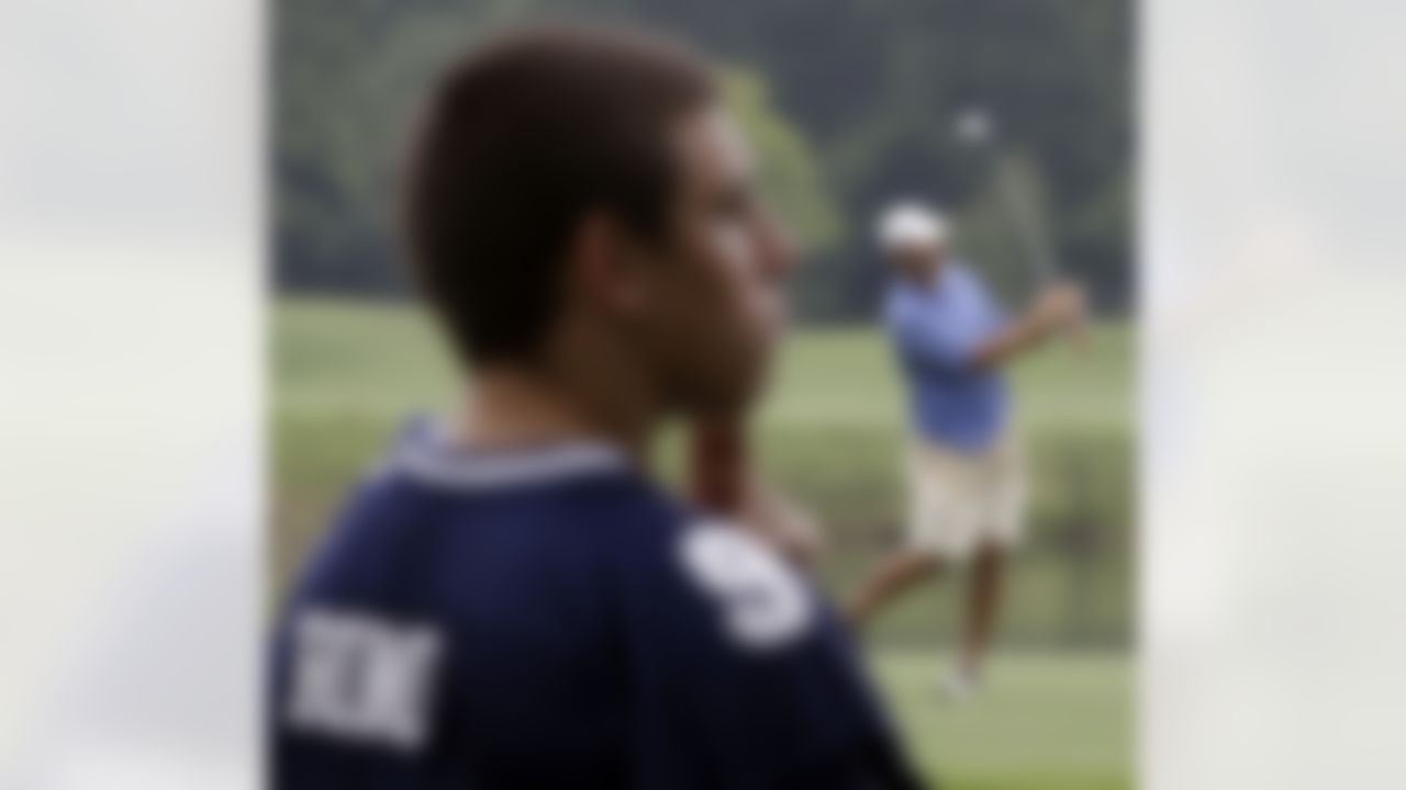 Troy Williams, left, wears a Dallas Cowboys quarterback Tony Romo jersey as he watches Romo, right, during sectional qualifying for the 2010 U.S. Open golf tournament Monday, June 7, 2010, at the Club at Carlton Woods in The Woodlands, Texas. The U.S. Open will be played June 14-20 at Pebble Beach Golf Links in Pebble Beach, Calif. (AP Photo/David J. Phillip)