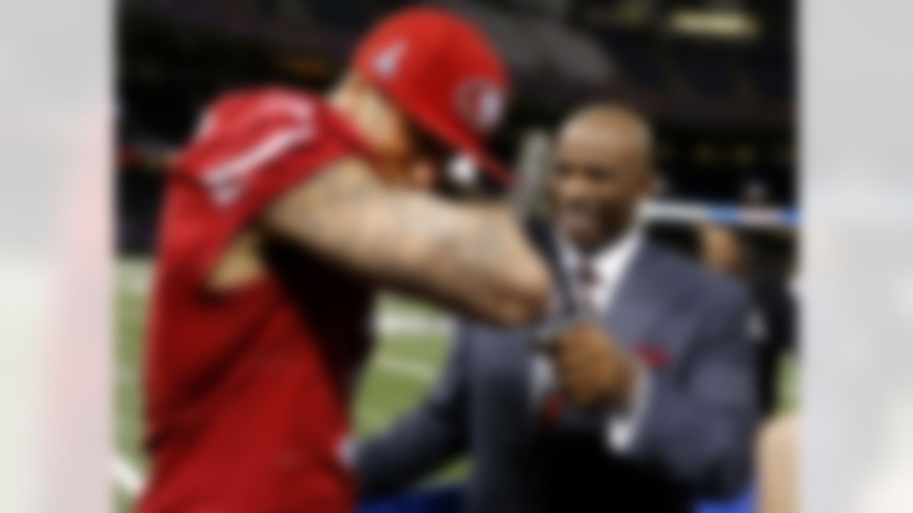 San Francisco 49ers quarterback Colin Kaepernick speaks with NFL Network's Deion Sanders during the Super Bowl XLVII Media Day at the Superdome on Tuesday, January 29, 2013 in New Orleans, LA. (Perry Knotts/NFL)