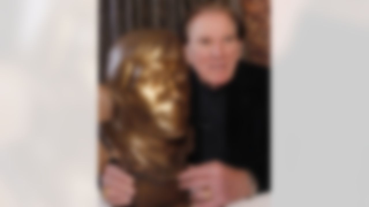 In this Nov. 14, 2011 photo, Hall of Fame football player Forrest Gregg poses with the clay model that was used for his bust in the NFL Hall of Fame after an interview where he talked about his battle with Parkinson's disease, in Colorado Springs, Colo. (AP Photo/Ed Andrieski)