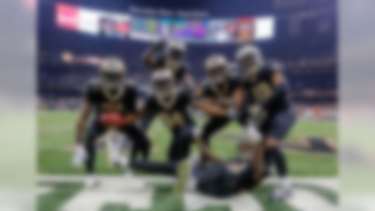 New Orleans Saints' Justin Hardee (center) celebrates with special teams teammates, posing for a photo in the endzone after a blocked punt for a touchdown against the Tampa Bay Buccaneers during the first quarter of a game at the Mercedes-Benz Superdome.