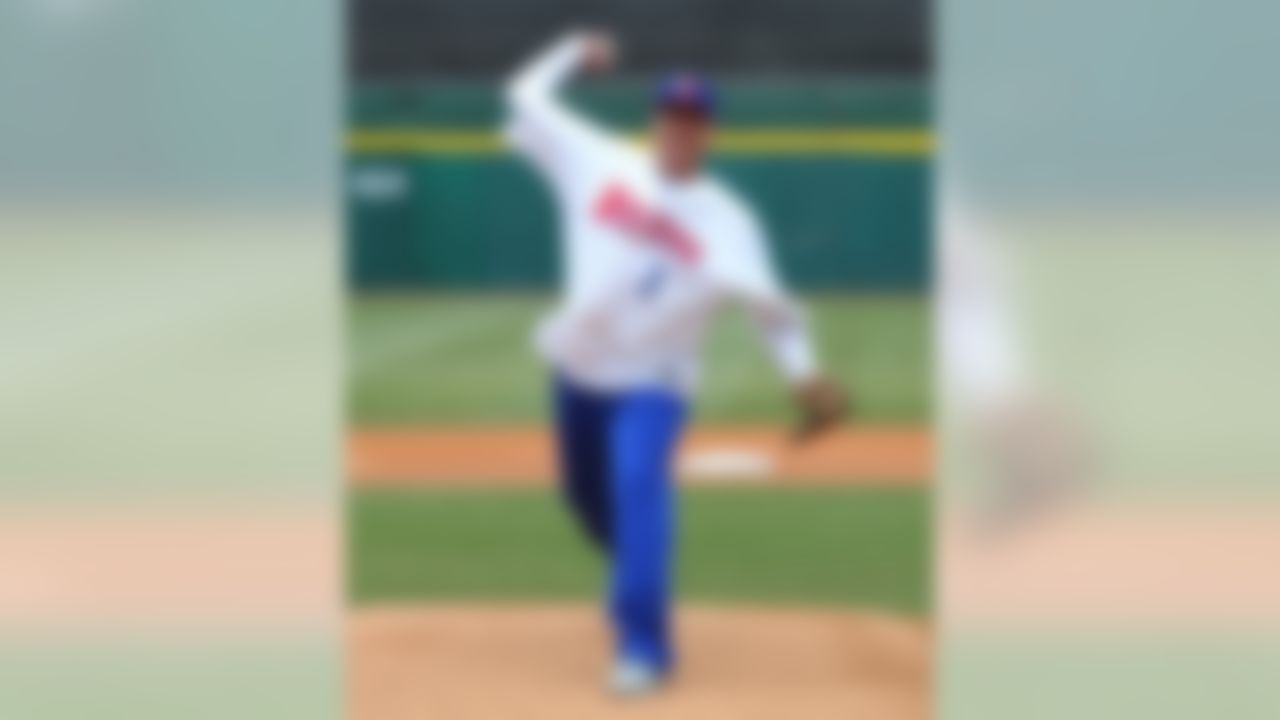 Buffalo Bills NFL football head coach Rex Ryan throws the ceremonial first pitch before the Triple-A baseball opener between the Buffalo Bisons and Rochester Red Wings in Buffalo, N.Y., Thursday, April 9, 2015. (AP Photo/Bill Wippert)