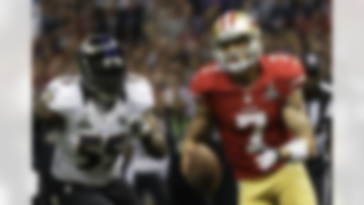 San Francisco 49ers quarterback Colin Kaepernick (7) carries the ball past Baltimore Ravens linebacker Terrell Suggs (55) during the first half of the NFL Super Bowl XLVII football game, Sunday, Feb. 3, 2013, in New Orleans. (AP Photo/Matt Slocum)