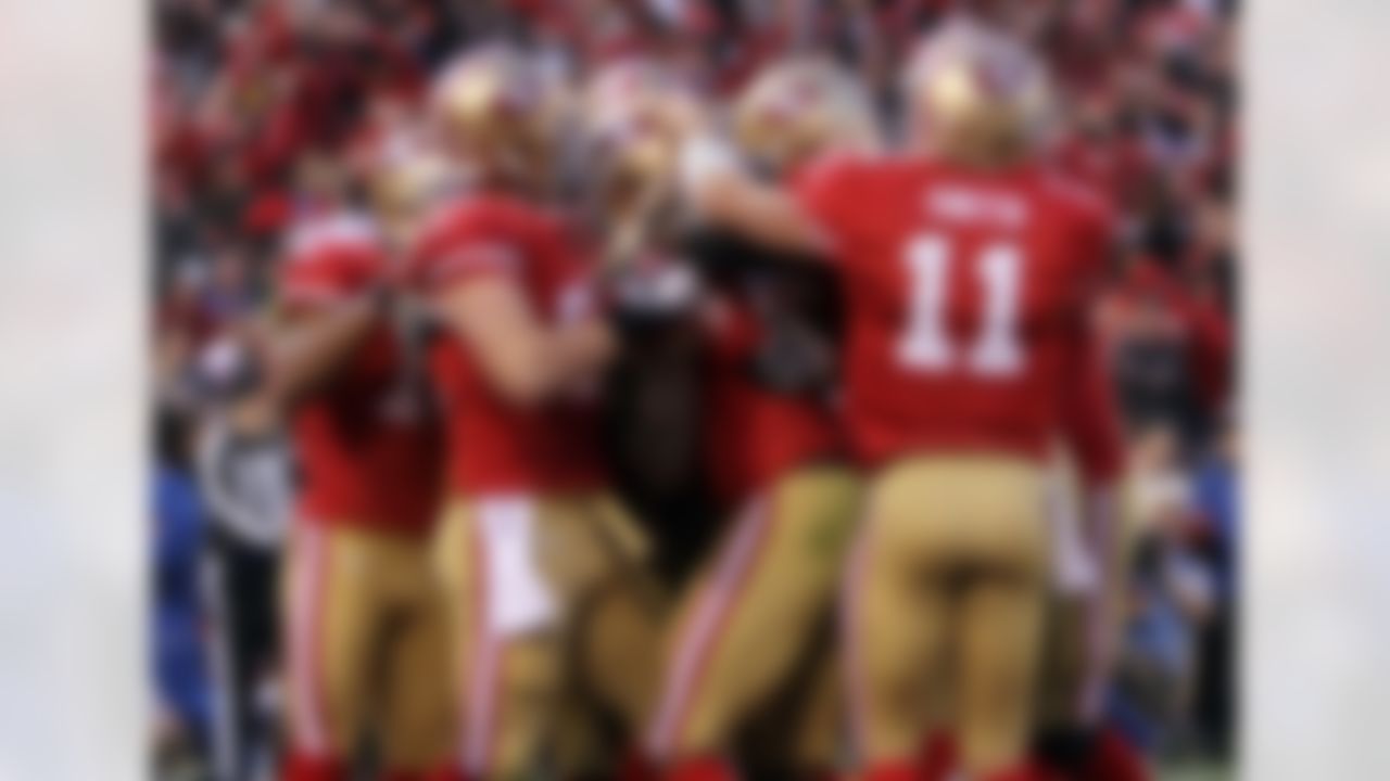 The San Francisco 49ers celebrate a game winning touchdown by tight end Veron Davis during an NFL divisional playoff football game against the New Orleans Saints at Candlestick Park in San Francisco, on Saturday, Jan. 14, 2012. (Ben Liebenberg/NFL)