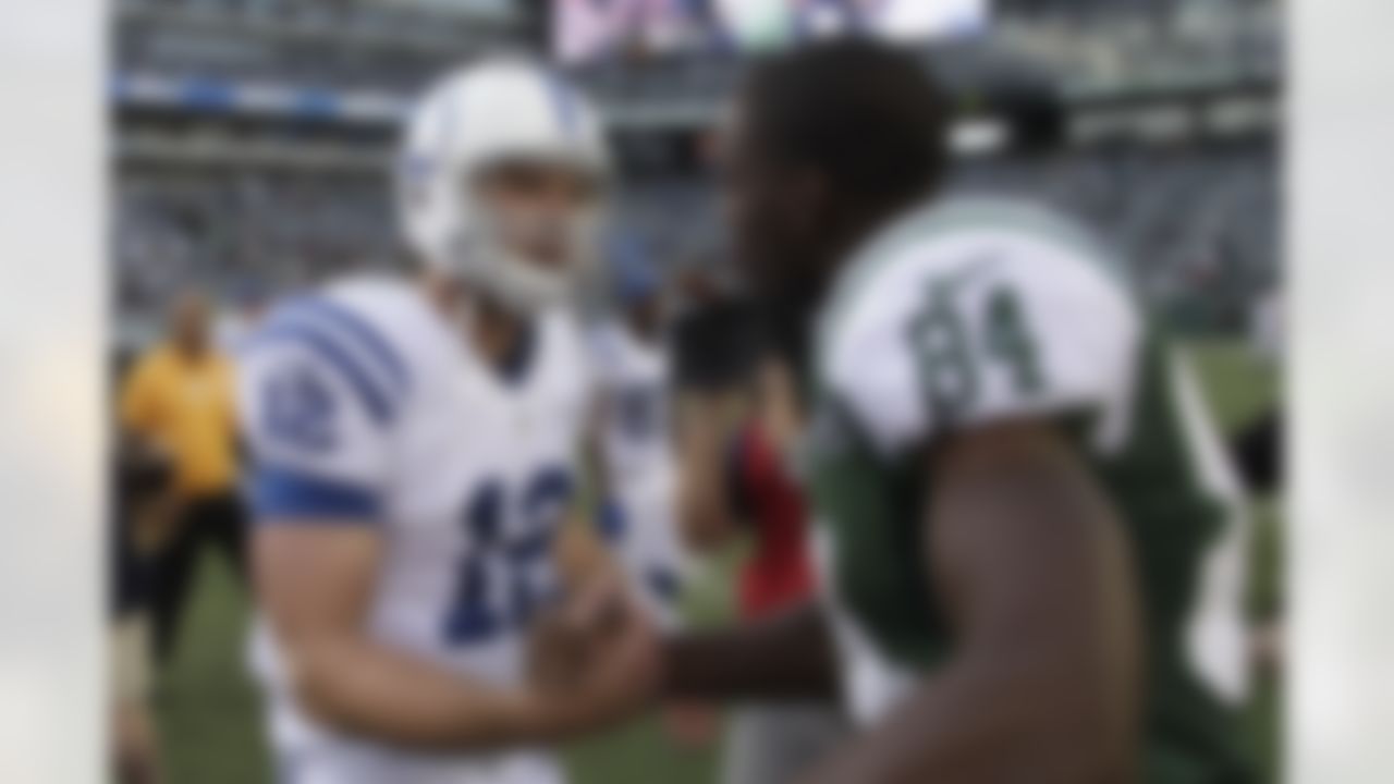 Indianapolis Colts quarterback Andrew Luck, left, greets New York Jets' Stephen Hill after the NFL football game Sunday, Oct. 14, 2012 in East Rutherford, N.J. The Jets won the game 35-9. (AP Photo/Seth Wenig)