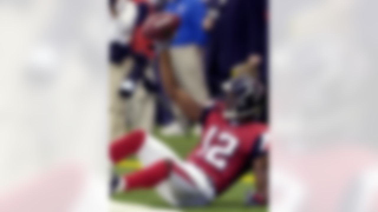 ATLANTA, GA - SEPTEMBER 30: Wide receiver Michael Jenkins #12 of the Atlanta Falcons grabs a touchdown pass in the end zone against the Houston Texans at the Georgia Dome on September 30, 2007 in Atlanta, Georgia. (Photo by Al Messerschmidt/Getty Images)