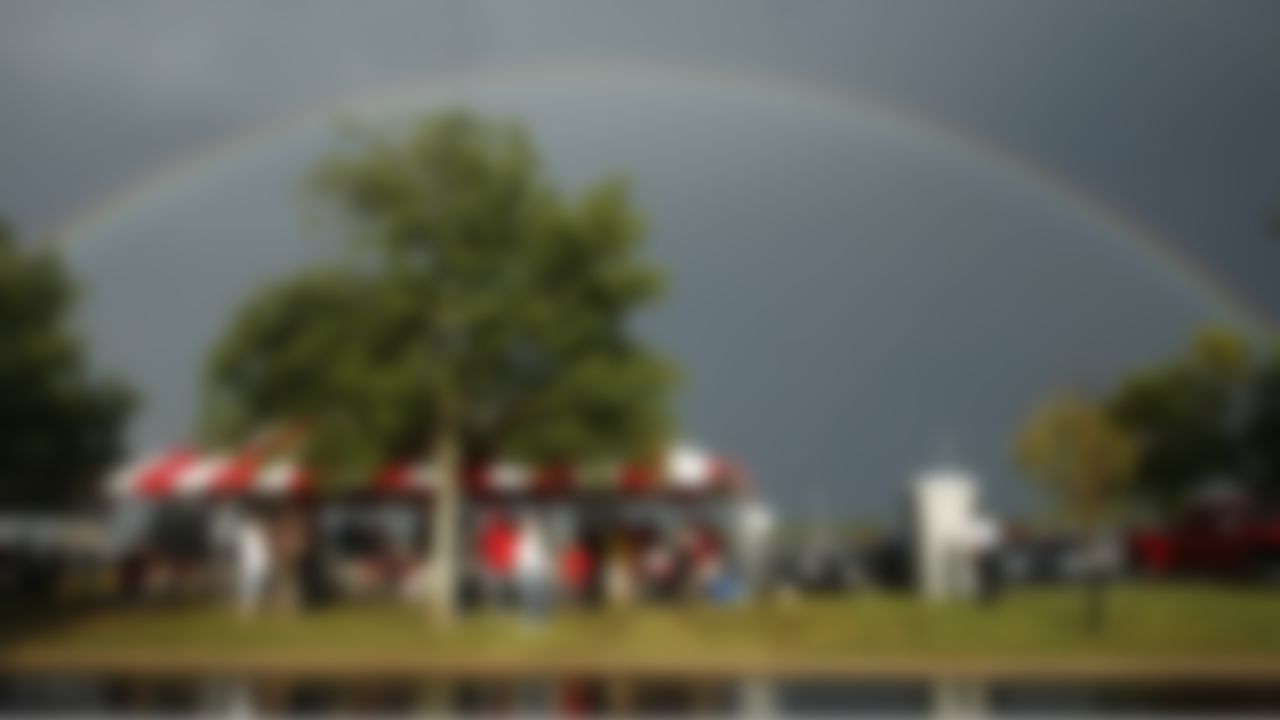 A rainbow fills the sky over tailgaters before the start of a preseason NFL football game between the Green Bay Packers and Kansas City Chiefs in Arrowhead Stadium in Kansas City, Mo., Thursday, Sept. 2, 2010. (AP Photo/Orlin Wagner)