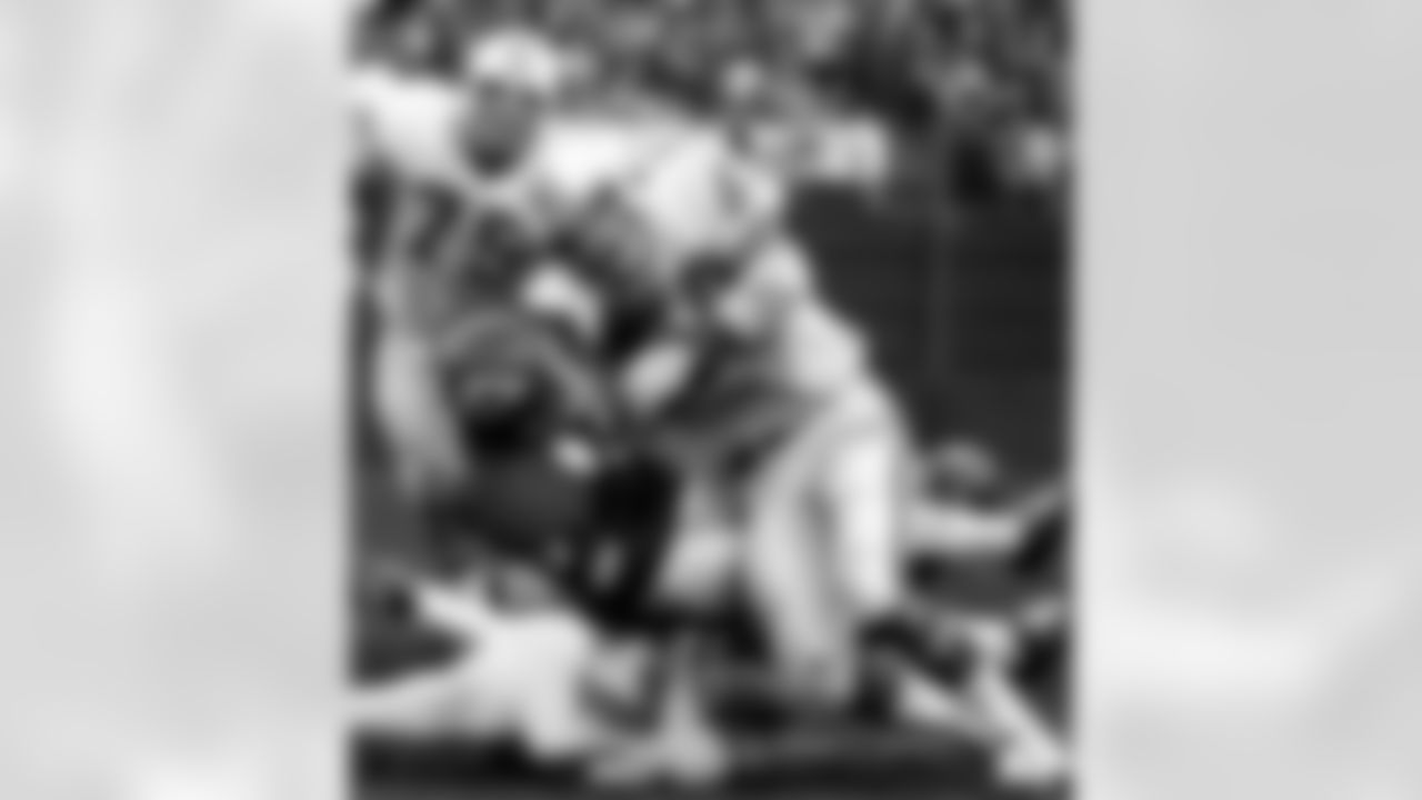 Kansas City Chiefs wide receiver Elmo Wright (12) catches a pass with Miami Dolphins linebacker Doug Swift (59) draped over him during the 1971 AFC Playoff, a double-overtime Dolphins victory on December 25, 1971, at Kansas City Municipal Stadium in Kansas City, Missouri. (Photo by Rod Hanna/NFL)