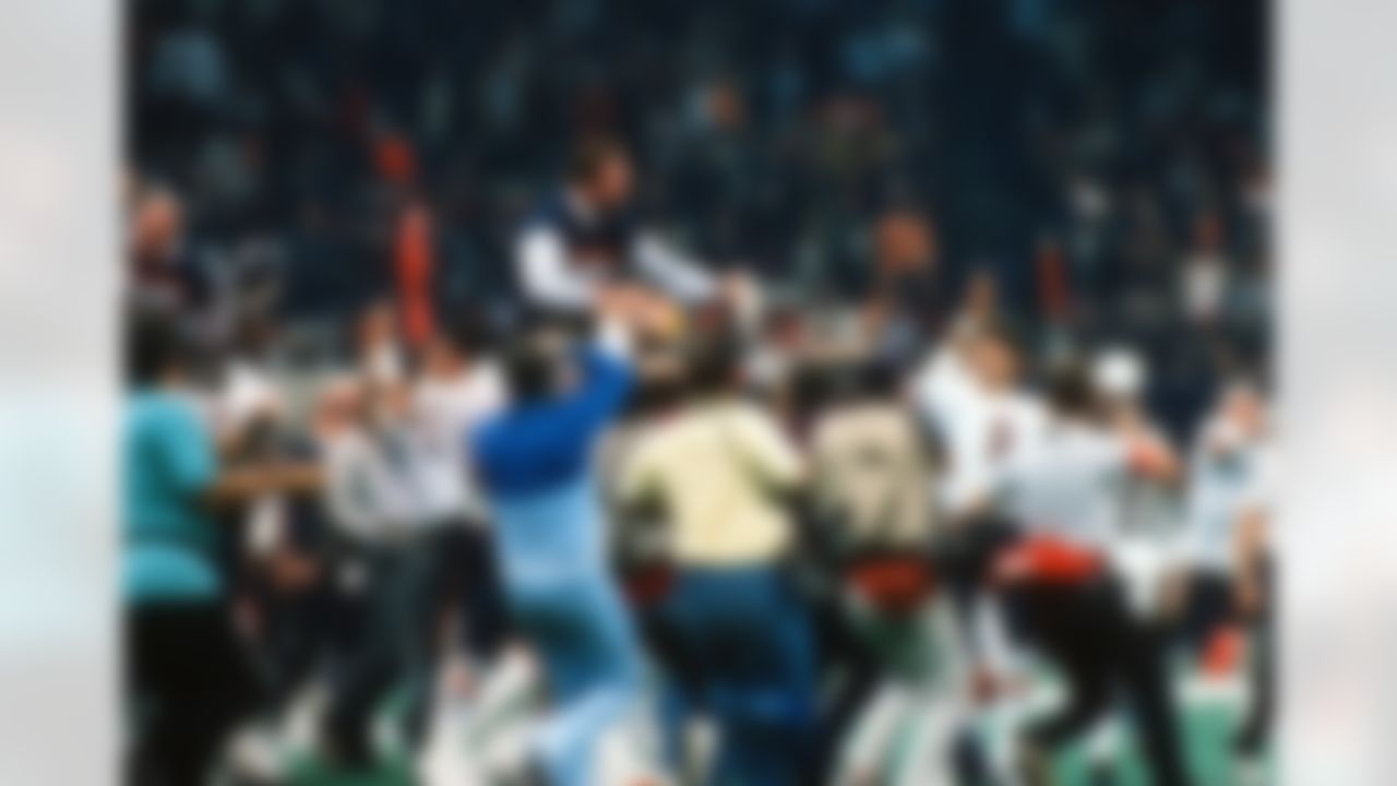 Chicago Bears head coach, Mike Ditka, being carried off the field on the shoulders of the Chicago Bears football team, after the Chicago Bears won Super Bowl XX at the Louisiana Superdome in New Orleans, LA. (AP Photo/Warren Wimmer)