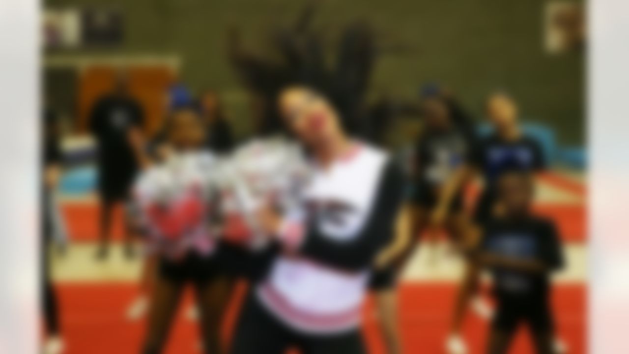 Atlanta Falcons Cheerleaders perform a routine while visiting Marshals Cheer and Dance to teach a routine and wish them good luck for their visit to the USA next year on Thursday, Oct 22, 2014 outside of London. Marshals Cheer and Dance have been invited to represent England in Atlanta at 'Cheer Sport 2015' in February 2015. (Dave Shopland/NFL)