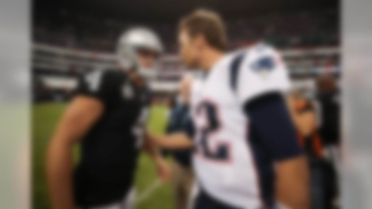 Oakland Raiders quarterback Derek Carr (4) greets New England Patriots quarterback Tom Brady (12) following an NFL football game on Sunday, Nov. 19, 2017, in Mexico City.