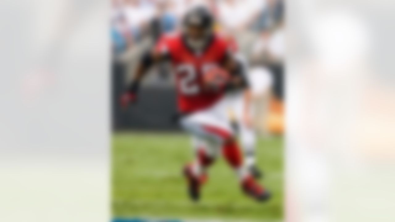 In 11 seasons with the Buccaneers and Falcons, Warrick Dunn has rushed for 10, 044 yards. Photo by Paul Abell-US PRESSWIRE.