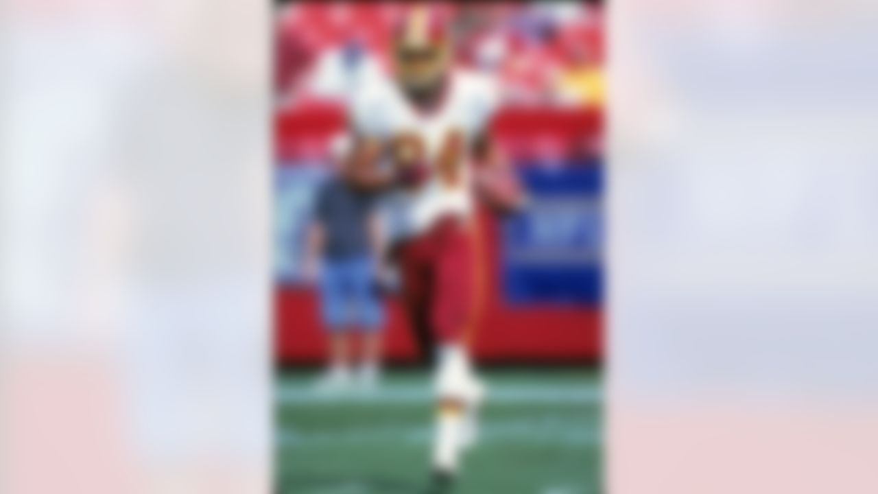 WASHINGTON, D.C. - OCTOBER 15: Wide receiver Andre Reed #84 of the Washington Redskins runs with a reception prior to a game against the Baltimore Ravens at FedEx Field on October 15, 2000 in Washington, D.C. The Redskins defeated the Ravens 10-3. (NFL Photo)