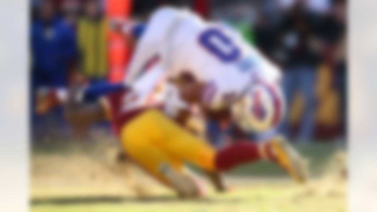 Buffalo Bills wide receiver Robert Woods (10) is upended by Washington Redskins defensive back DeAngelo Hall (23) during the first half of an NFL football game in Landover, Md., Sunday, Dec. 20, 2015.