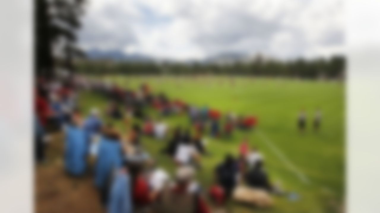 Fans watch the Arizona Cardinals during the first day of NFL football training camp at Northern Arizona University, Wednesday, July 25, 2012, in Flagstaff, Ariz. (AP Photo/Ross D. Franklin)