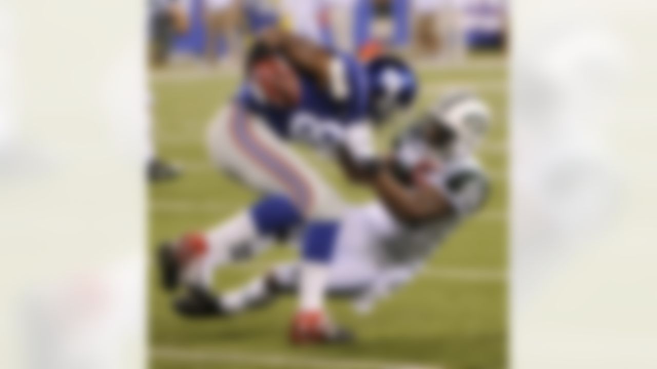New York Jets' Darrelle Revis, right, tackles New York Giants' Hakeem Nicks during the second quarter of an NFL preseason football game, Monday, Aug. 29, 2011, in East Rutherford, N.J. (AP Photo/Bill Kostroun)