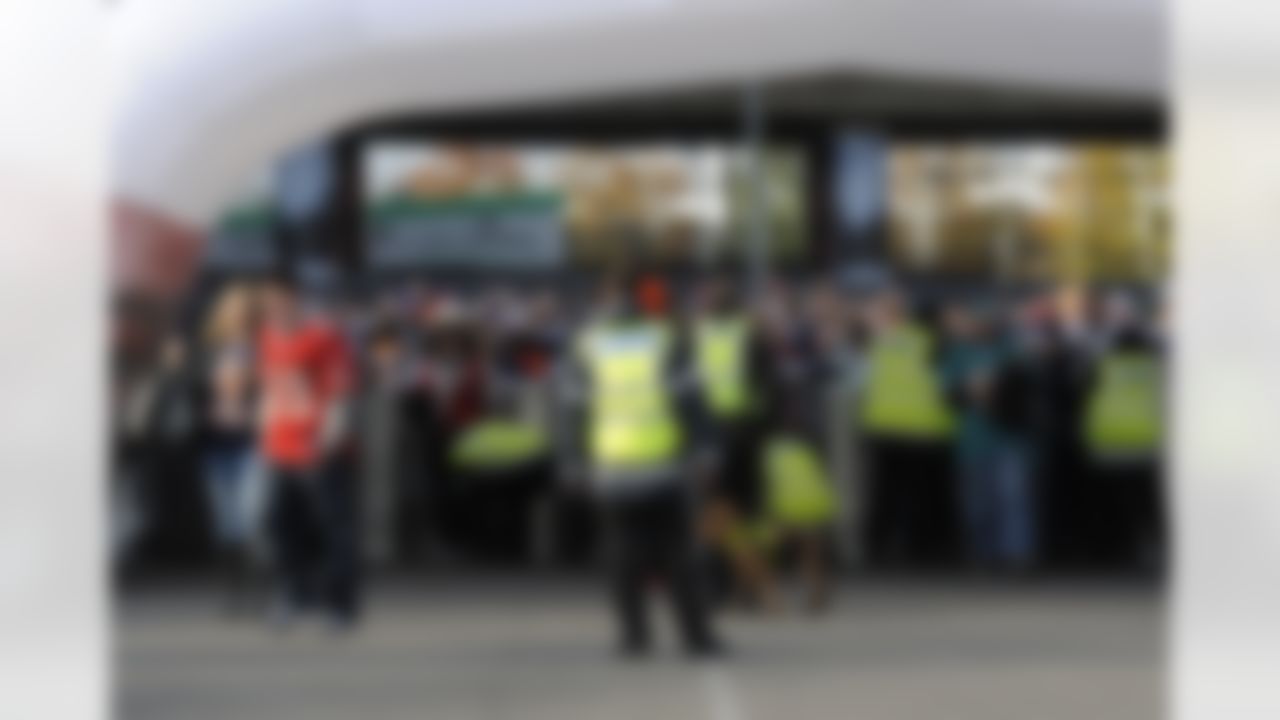 Venure security guards check fans outside of Wembley Stadium on October 23, 2011 in London England. The Tampa Bay Buccaneers play the Chicago Bears in the 2011 International Series. (Dave Shopland/NFL)