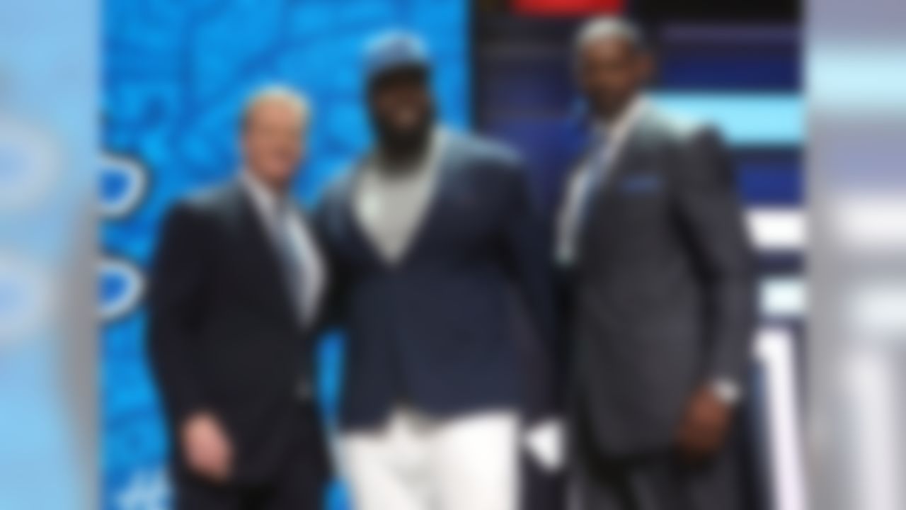 Alabama defensive tackle A'Shawn Robinson poses for a photo with NFL Commissioner Roger Goodell and former Detroit Lions player Herman Moore after being selected by the Detroit Lions during the 2016 NFL Draft at the Auditorium Theatre on Friday, April 29, 2016 in Chicago. (Perry Knotts/NFL)