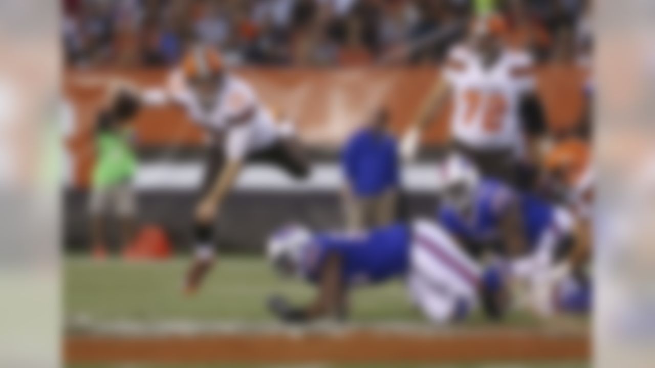 Cleveland Browns quarterback Josh McCown (13) is sacked by Buffalo Bills defensive end Jerry Hughes (55) during the first quarter of an NFL preseason football game, Thursday, Aug. 20, 2015, in Cleveland. (AP Photo/Ron Schwane)