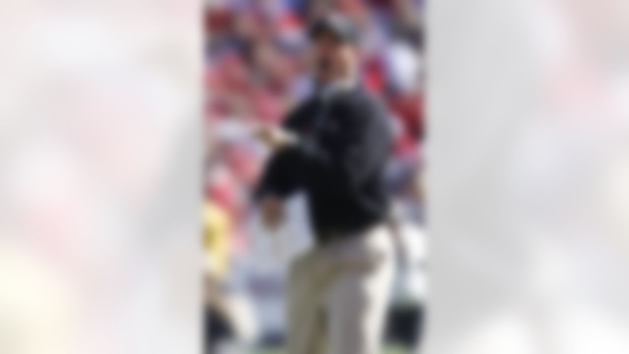 San Francisco 49ers head coach Jim Harbaugh yells at an official during the second half of an NFL football game against the Dallas Cowboys in San Francisco, Sunday, Sept. 18, 2011. (AP Photo/Tony Avelar)
