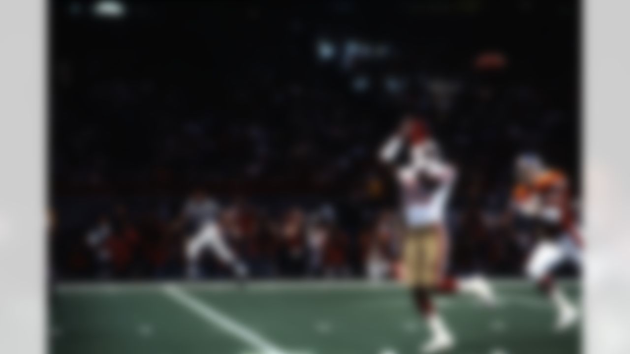 San Francisco 49ers Hall of Fame wide receiver Jerry Rice (80) catches a 28-yard touchdown pass behind Denver Broncos safety Dennis Smith (49) during a Super Bowl XXIV NFL game in New Orleans, on January 28, 1990. The 49ers defeated the Broncos 55-10. (AP Photo/Vernon Biever)