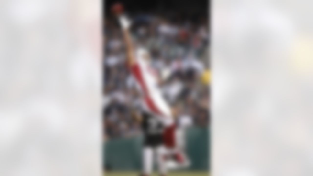 OAKLAND, CA - AUGUST 11: Wide receiver Larry Fitzgerald #11 of the Arizona Cardinals makes a leaping attempt at a catch during a game against the Oakland Raiders on August 11, 2007 at McAfee Stadium in Oakland, California. (Photo by Greg Trott/Getty Images)